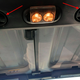 The outgoing “JK” Wrangler’s “Freedom Top” uses two knobs to fasten the top to the sound bar.